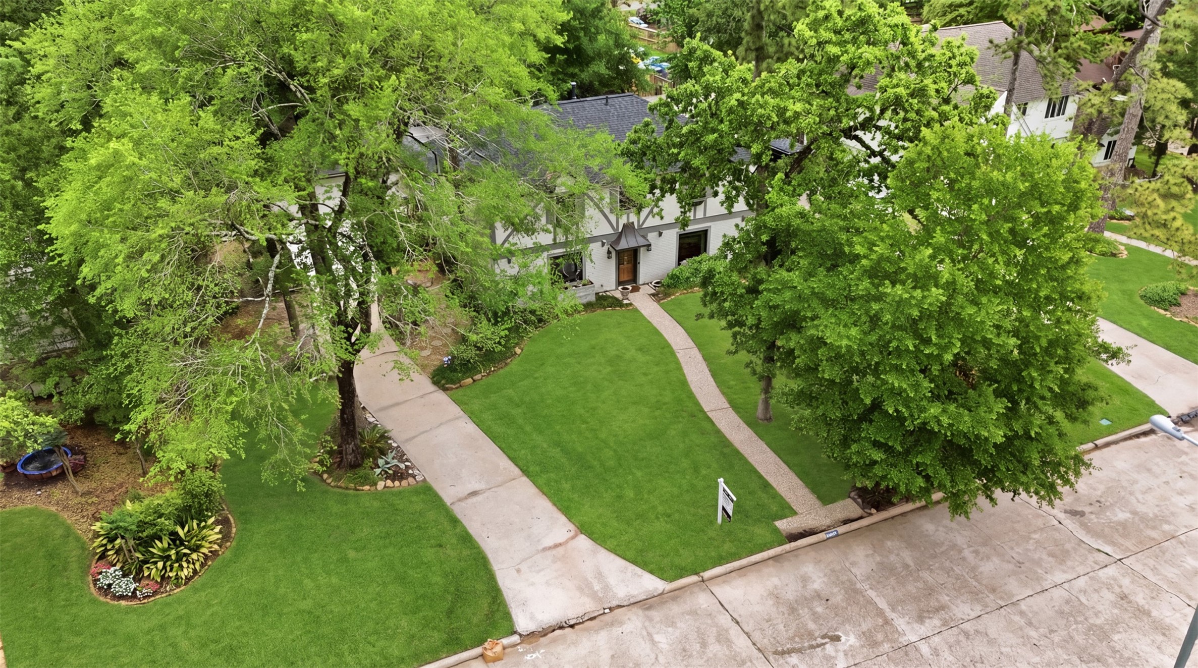 6126 Hickorycrest Drive Spring, TX 77389 - Photo 46 of 50 Aerial front view showing the home’s curb appeal, driveway, and mature trees.