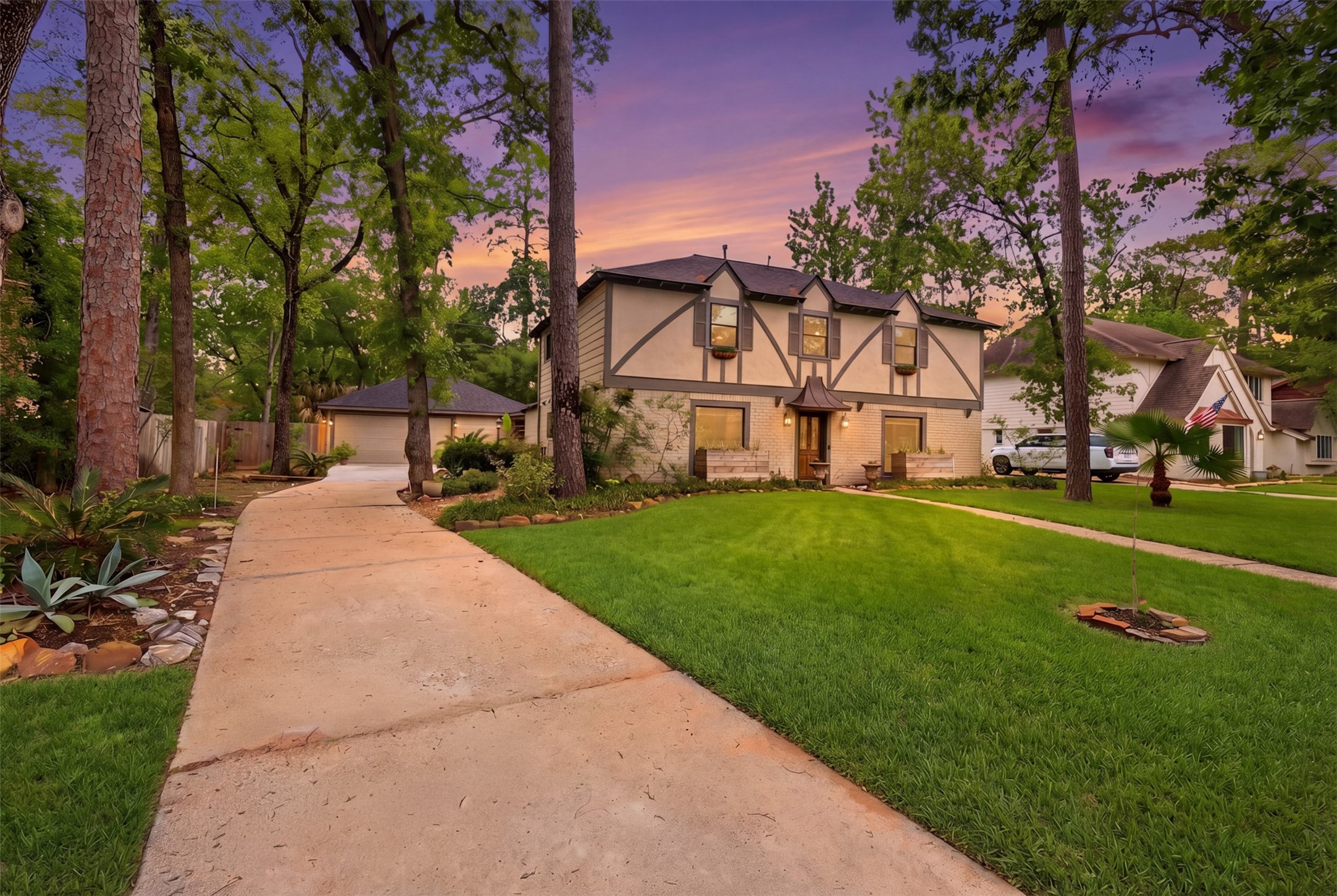 6126 Hickorycrest Drive Spring, TX 77389 - Photo 47 of 50 Front exterior view at sunset highlighting the home’s façade and landscaped yard.