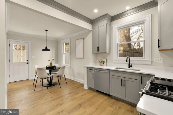 a kitchen with a sink cabinets and window