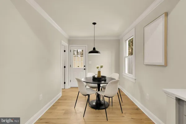 a dining room with furniture and window