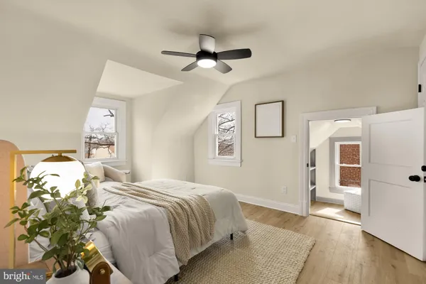 a bedroom with a bed and a mirror