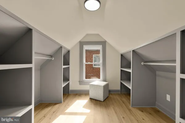 a living room with a couch and a window