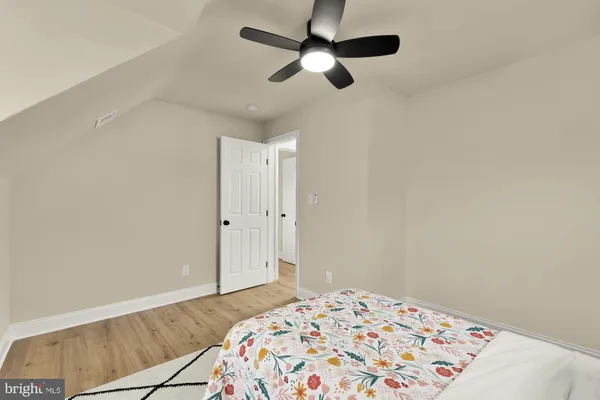a bedroom with a bed and a dresser