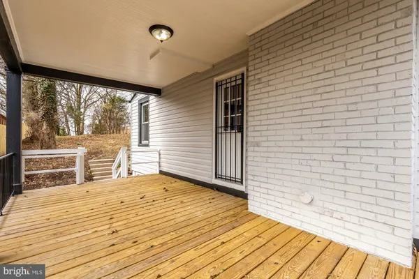 a view of a patio with wooden floor