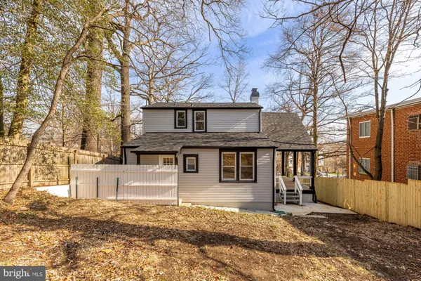 a view of a house with a yard covered in snow