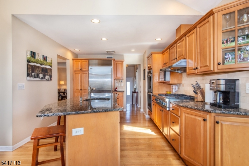 29 Long Acres Road Fairfield, NJ 07004 - Photo 11 of 33 a kitchen with stainless steel appliances granite countertop a refrigerator a stove and a sink