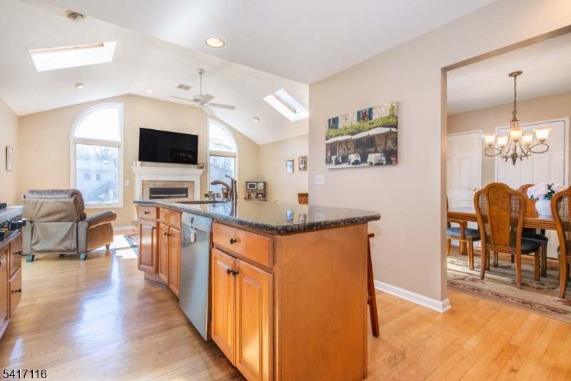 29 Long Acres Road Fairfield, NJ 07004 - Photo 14 of 33 a living room with furniture and a flat screen tv