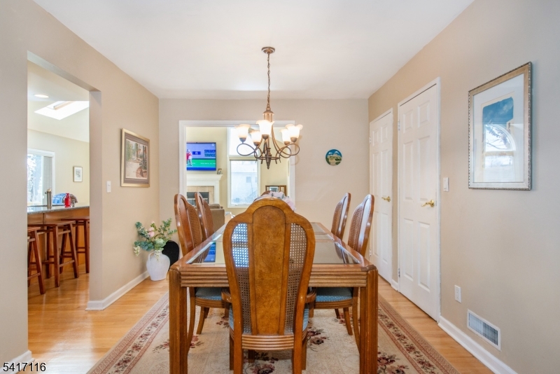 29 Long Acres Road Fairfield, NJ 07004 - Photo 16 of 33 a dining room with furniture window and wooden floor