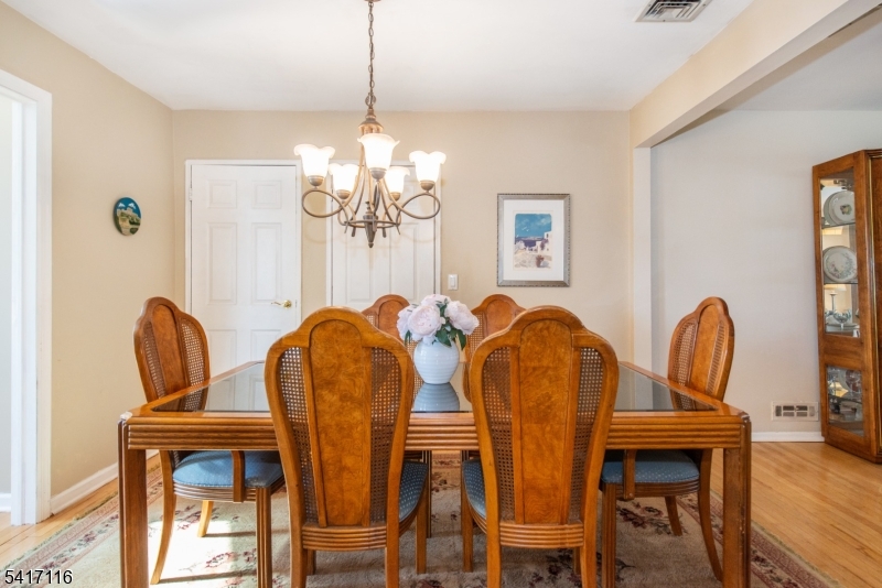 29 Long Acres Road Fairfield, NJ 07004 - Photo 17 of 33 a view of a dining room with furniture and wooden floor