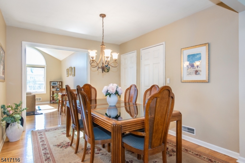 29 Long Acres Road Fairfield, NJ 07004 - Photo 19 of 33 a view of a dining room with furniture window and wooden floor