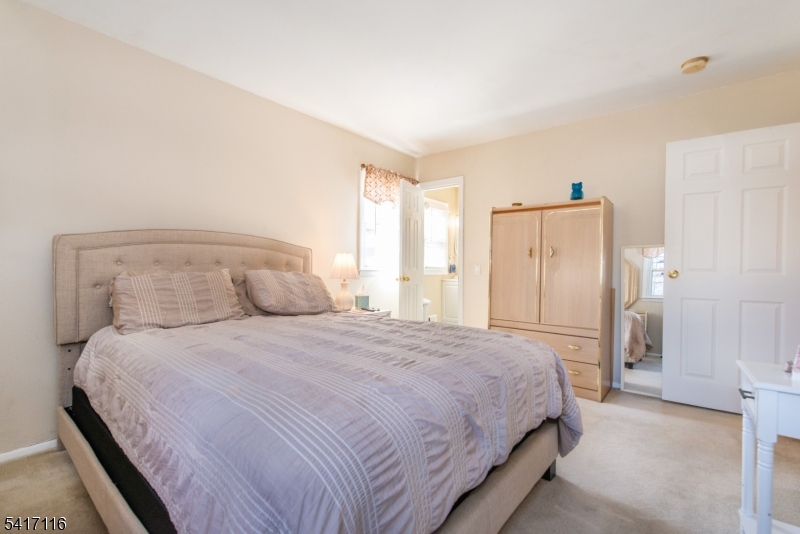 29 Long Acres Road Fairfield, NJ 07004 - Photo 20 of 33 a bedroom with a bed and a window