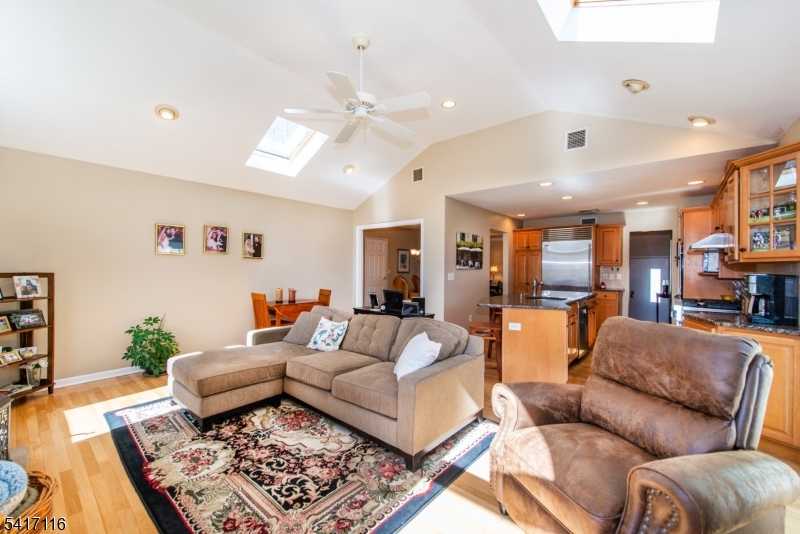 29 Long Acres Road Fairfield, NJ 07004 - Photo 2 of 33 a living room with furniture and wooden floor