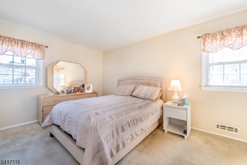 29 Long Acres Road Fairfield, NJ 07004 - Photo 22 of 33 a bedroom with bed and window