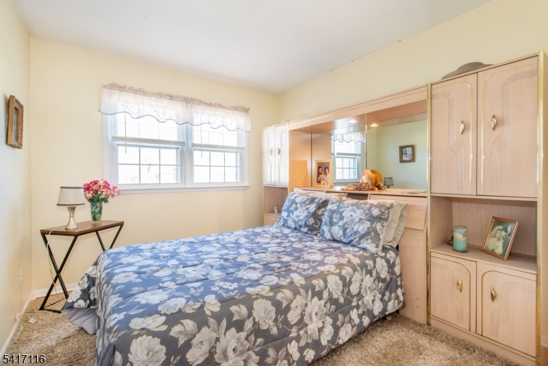 29 Long Acres Road Fairfield, NJ 07004 - Photo 24 of 33 a bedroom with a bed and window