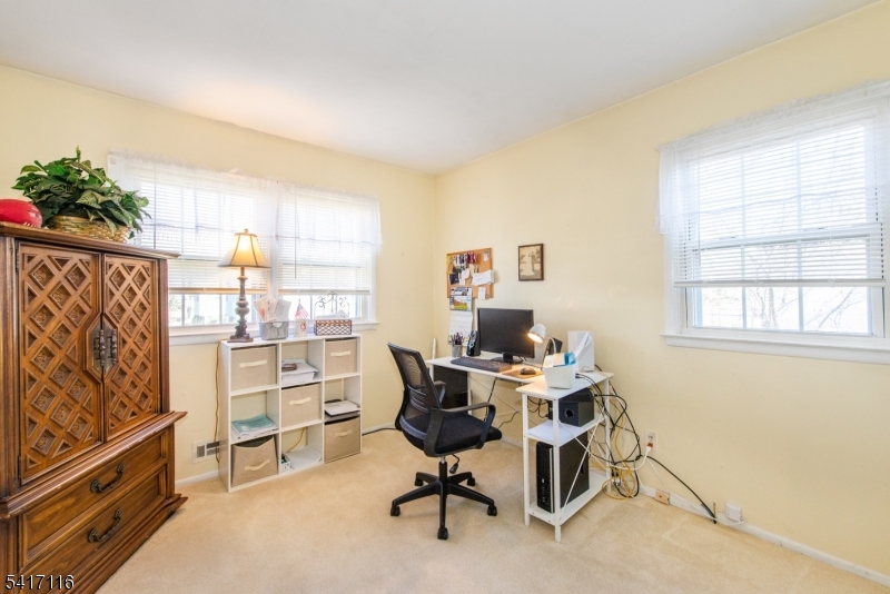 29 Long Acres Road Fairfield, NJ 07004 - Photo 25 of 33 a view of a workspace with furniture and a window