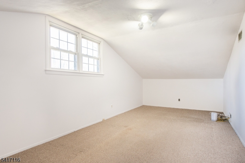 29 Long Acres Road Fairfield, NJ 07004 - Photo 28 of 33 an empty room with a window