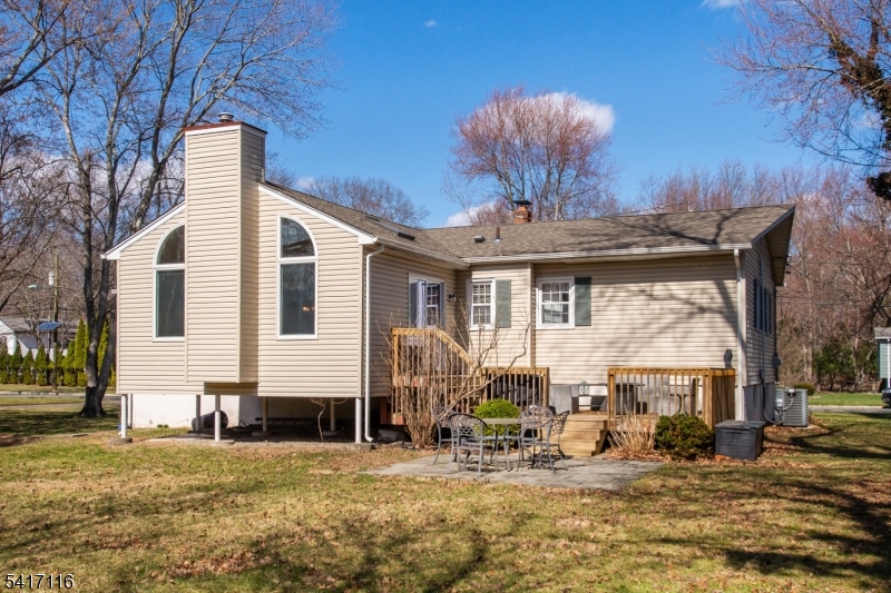 29 Long Acres Road Fairfield, NJ 07004 - Photo 29 of 33 a front view of a house with patio outdoor seating