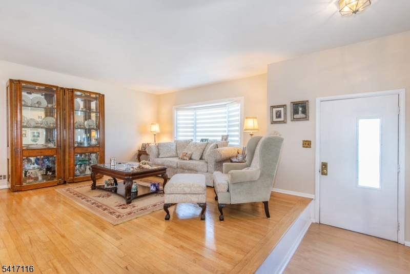 29 Long Acres Road Fairfield, NJ 07004 - Photo 6 of 33 a living room with furniture and large window