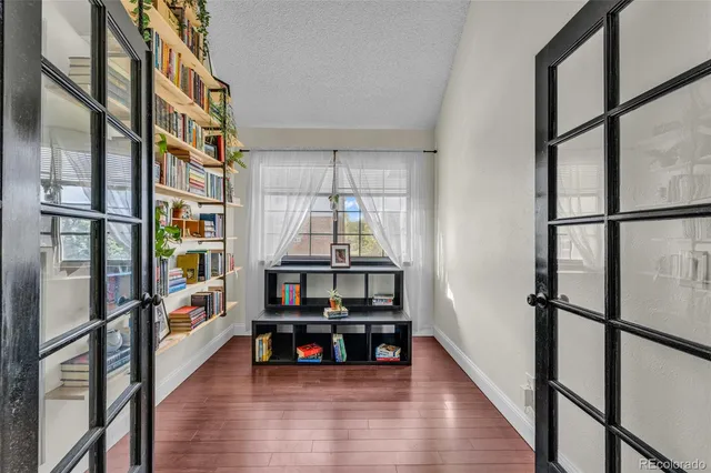 a view of an entryway with wooden floor