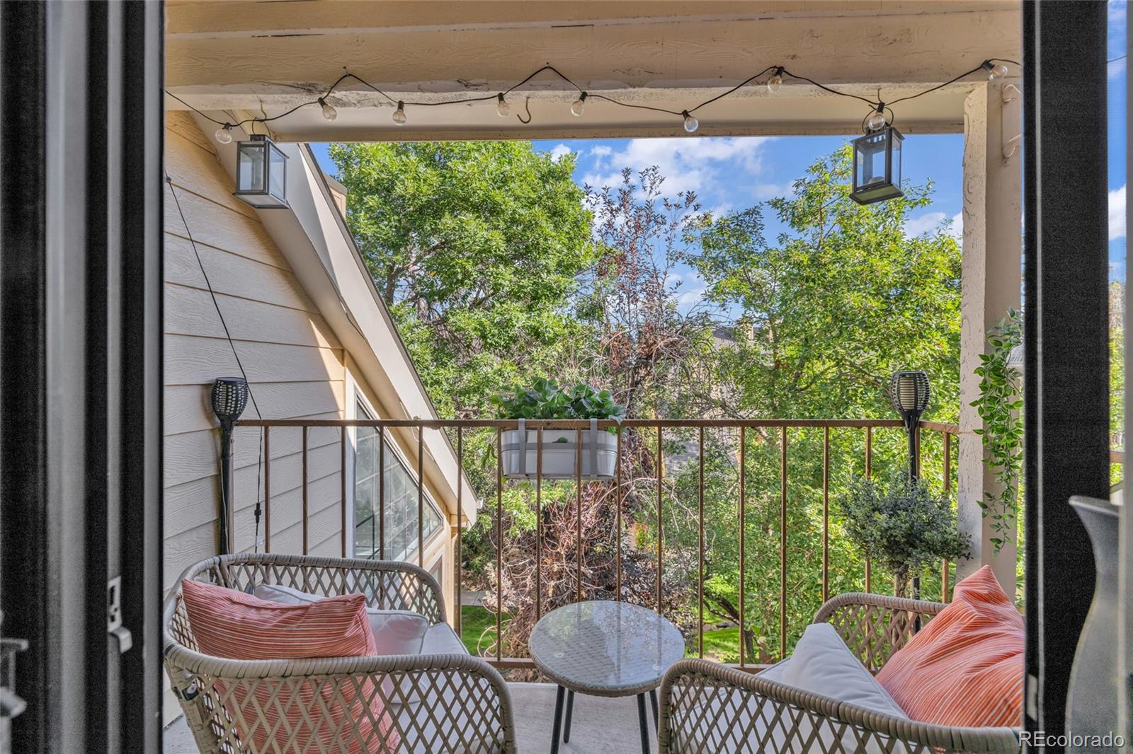 4840 East Kentucky Avenue, Unit F Denver, CO 80246 - Photo 16 of 18 a view of a balcony with chair and table