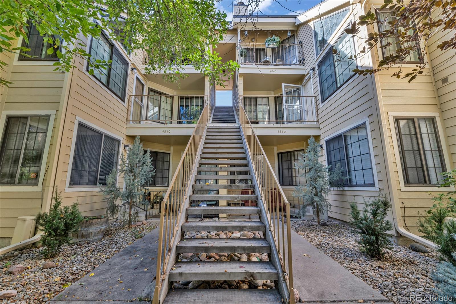 4840 East Kentucky Avenue, Unit F Denver, CO 80246 - Photo 2 of 18 a front view of a house with windows