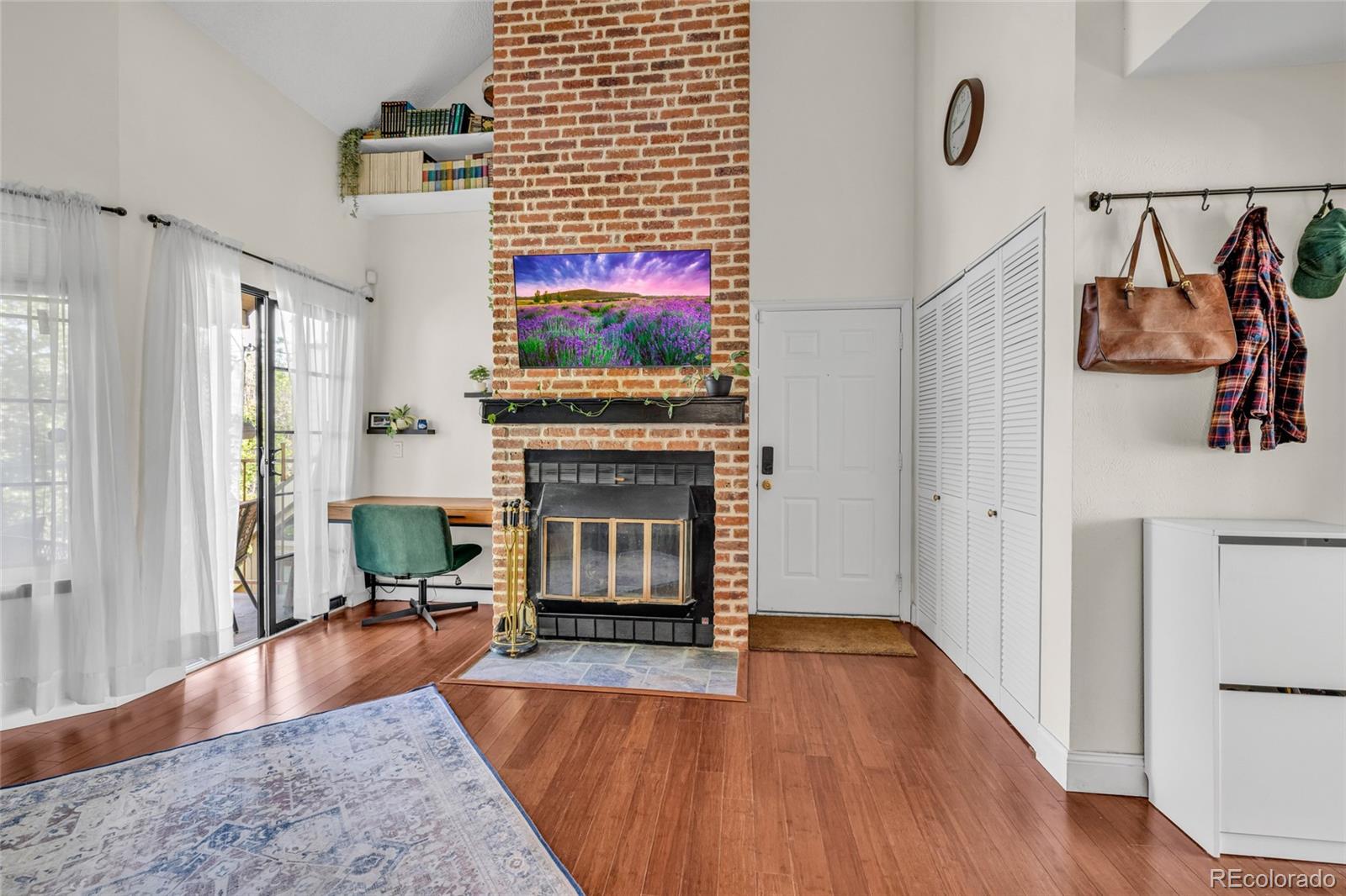 4840 East Kentucky Avenue, Unit F Denver, CO 80246 - Photo 6 of 18 a living room with furniture and a fireplace