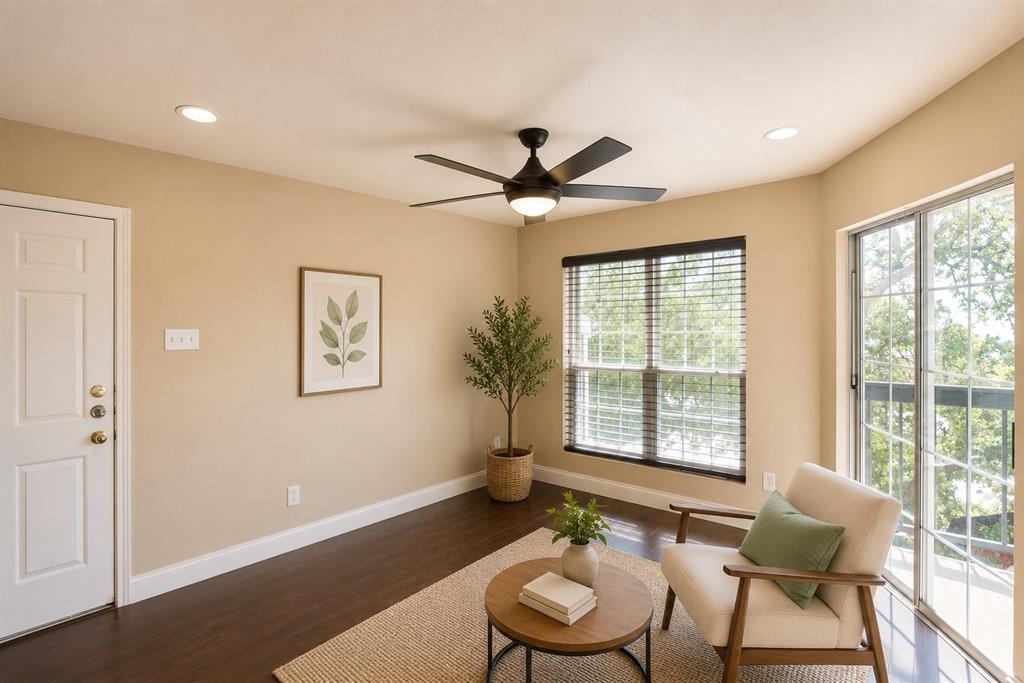 Room featuring wood-finish flooring, recessed lighting, and a modern ceiling fan