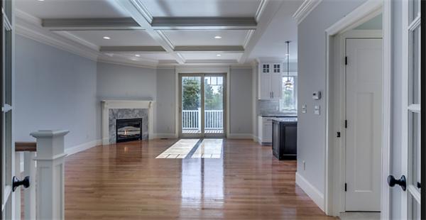 46 Maple Street Needham, MA 02492 - Photo 6 of 12 a view of empty room with wooden floor and fireplace