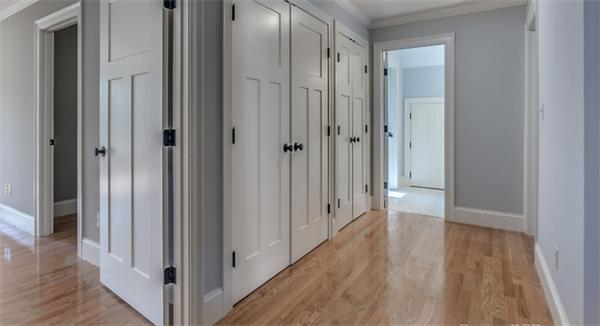 46 Maple Street Needham, MA 02492 - Photo 8 of 12 a view of a hallway with wooden floor