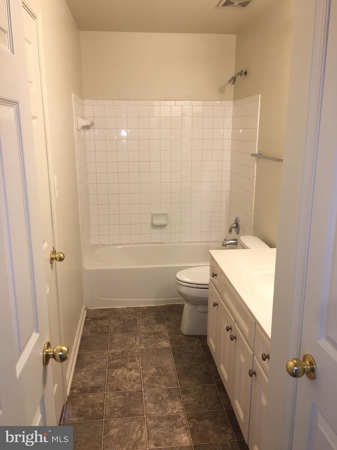 610 Pendleton Lane Strasburg, VA 22657 - Photo 14 of 30 a bathroom with a granite countertop sink toilet and shower