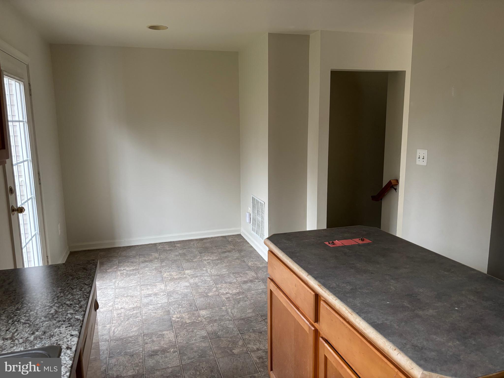 610 Pendleton Lane Strasburg, VA 22657 - Photo 26 of 30 an empty room with wooden floor and cabinet