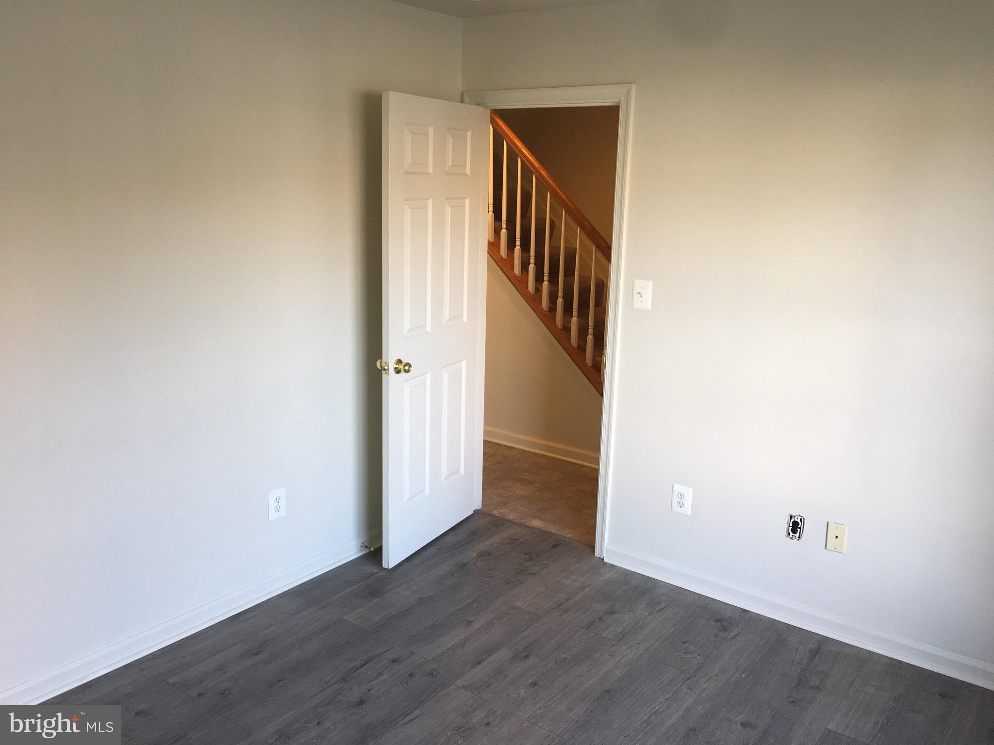 610 Pendleton Lane Strasburg, VA 22657 - Photo 3 of 30 a view of an empty room with wooden floor