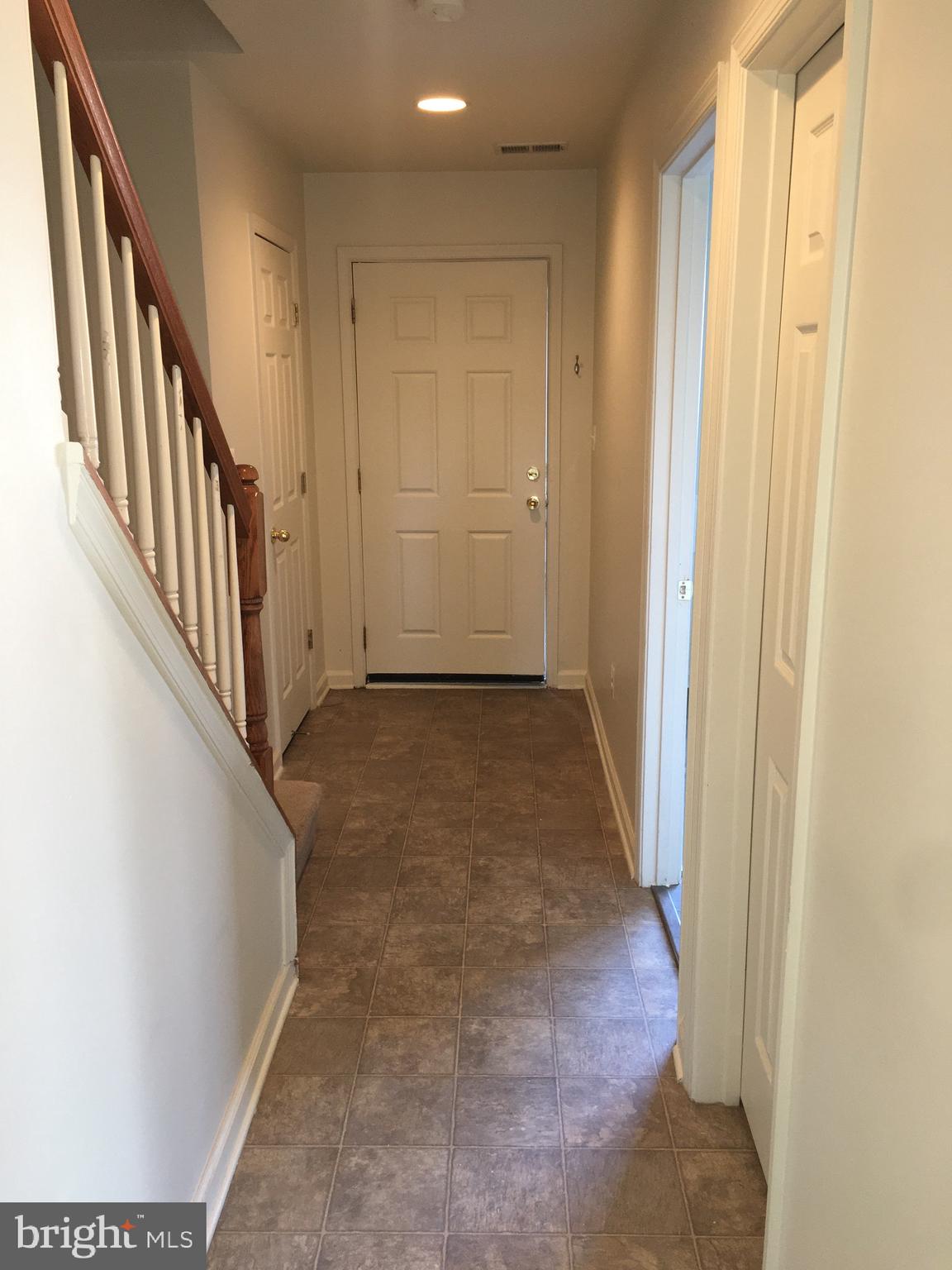 610 Pendleton Lane Strasburg, VA 22657 - Photo 4 of 30 a view of a hallway with wooden floor and staircase