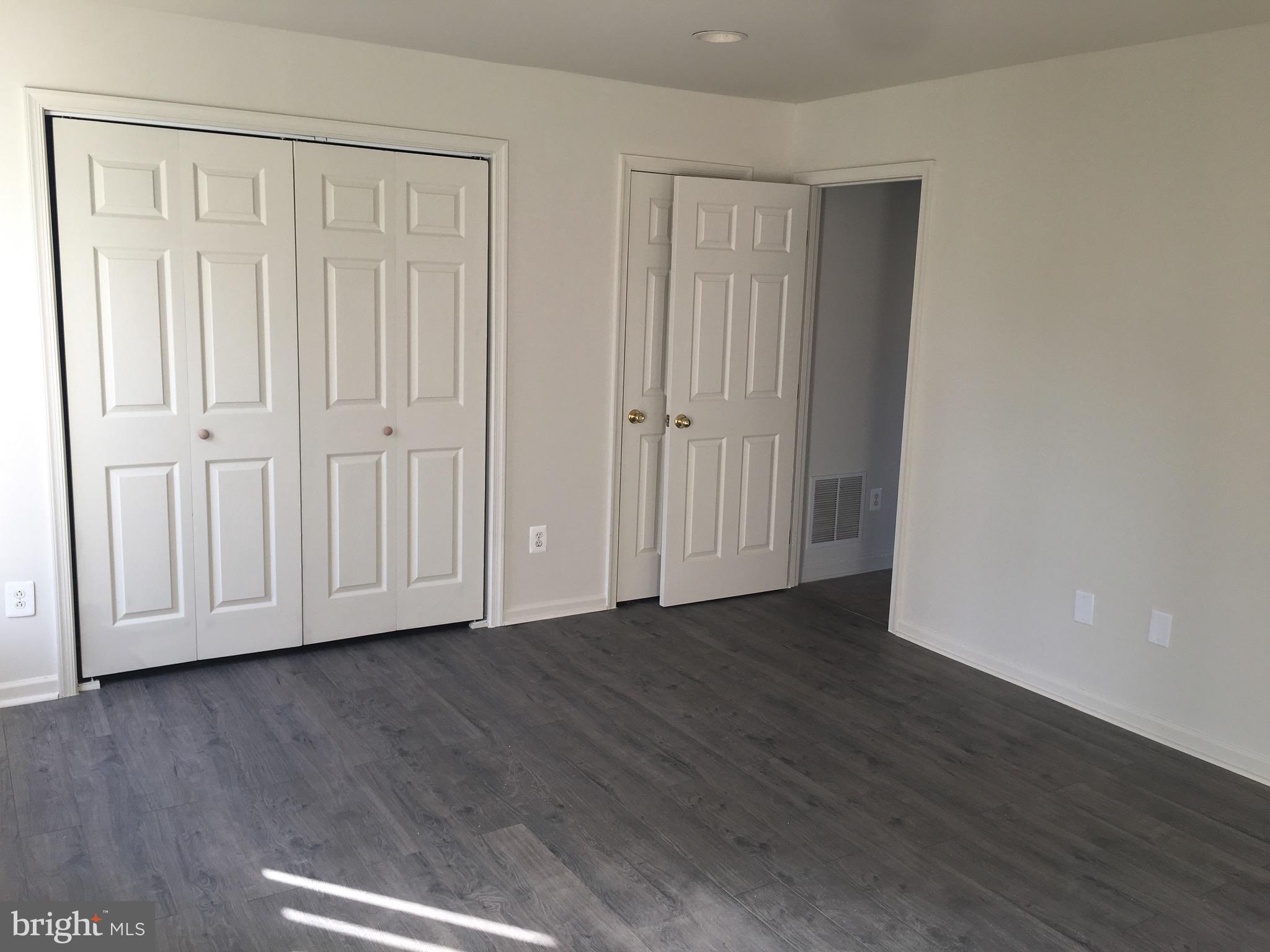 610 Pendleton Lane Strasburg, VA 22657 - Photo 7 of 30 a view of empty room with wooden floor