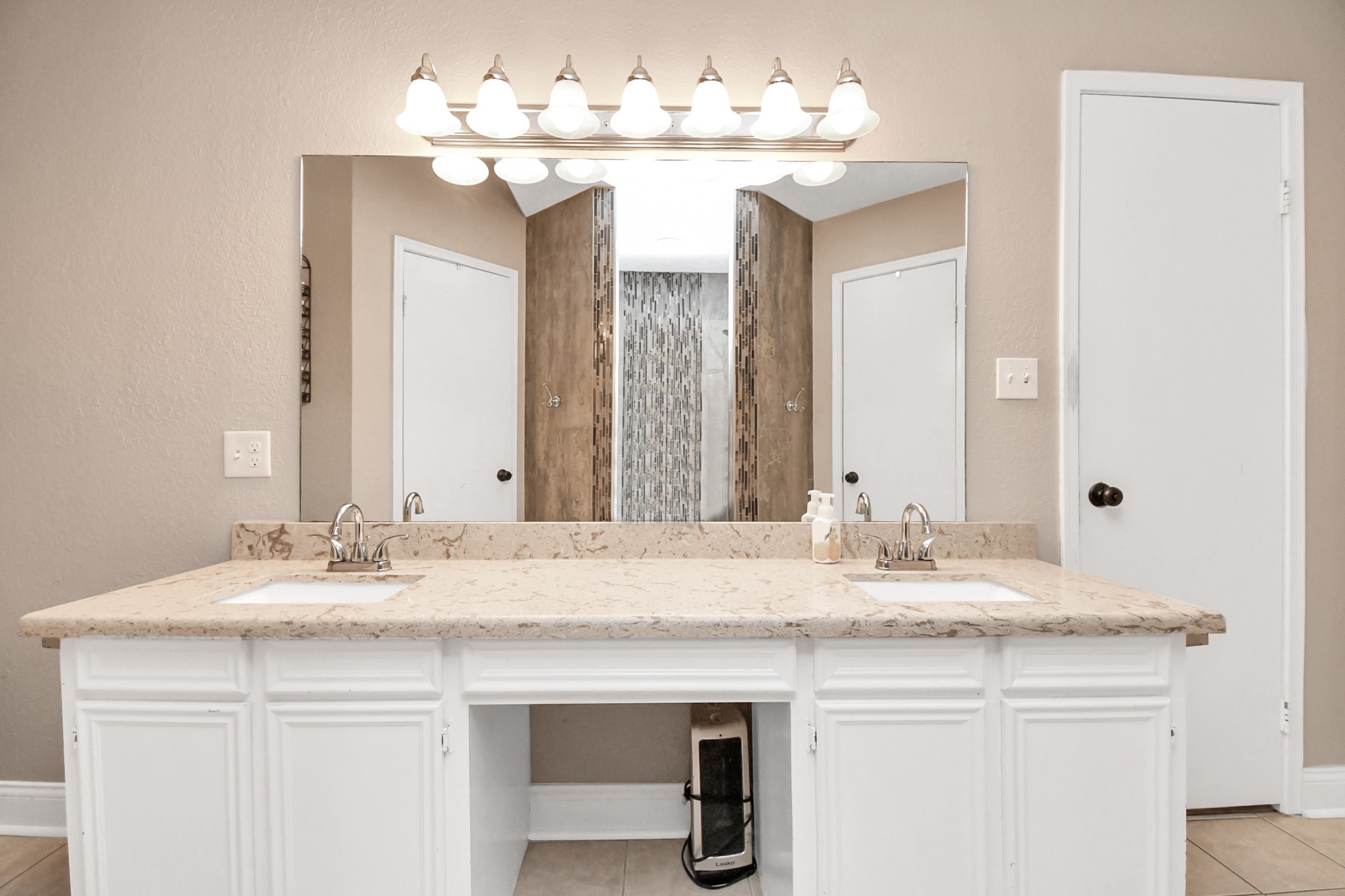 20202 Deer Run Road Damon, TX 77430 - Photo 17 of 45 a bathroom with a sink vanity and a mirror