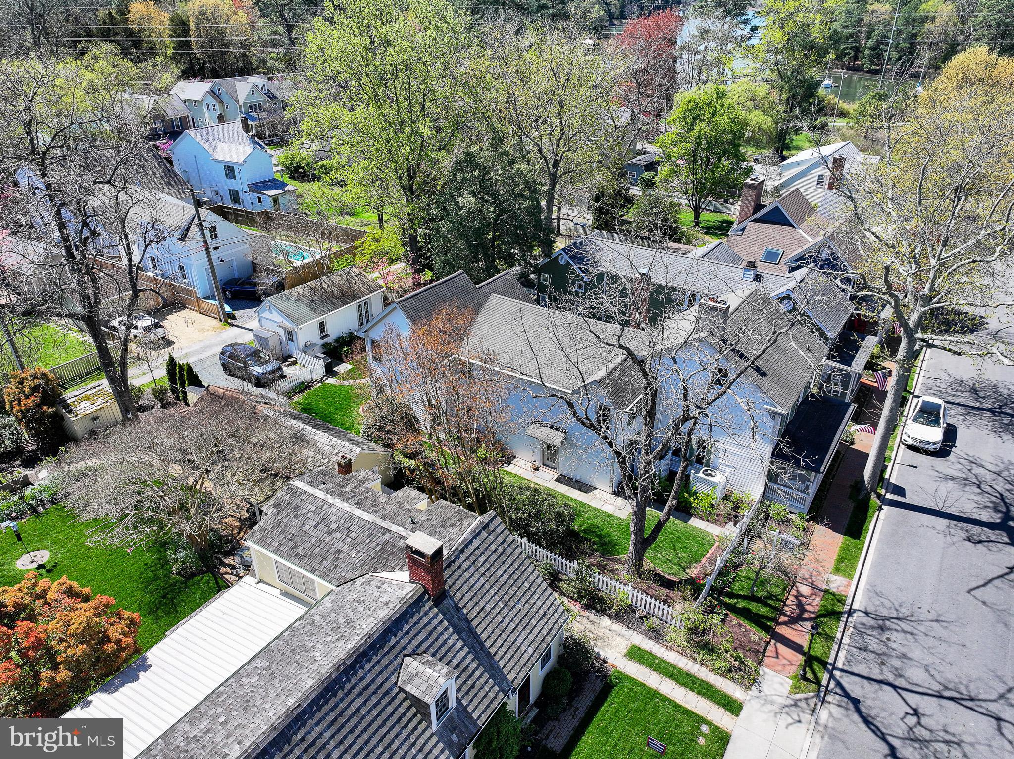 114 West Chestnut Street St. Michaels, MD 21663 - Photo 3 of 75 an aerial view of multiple houses with yard