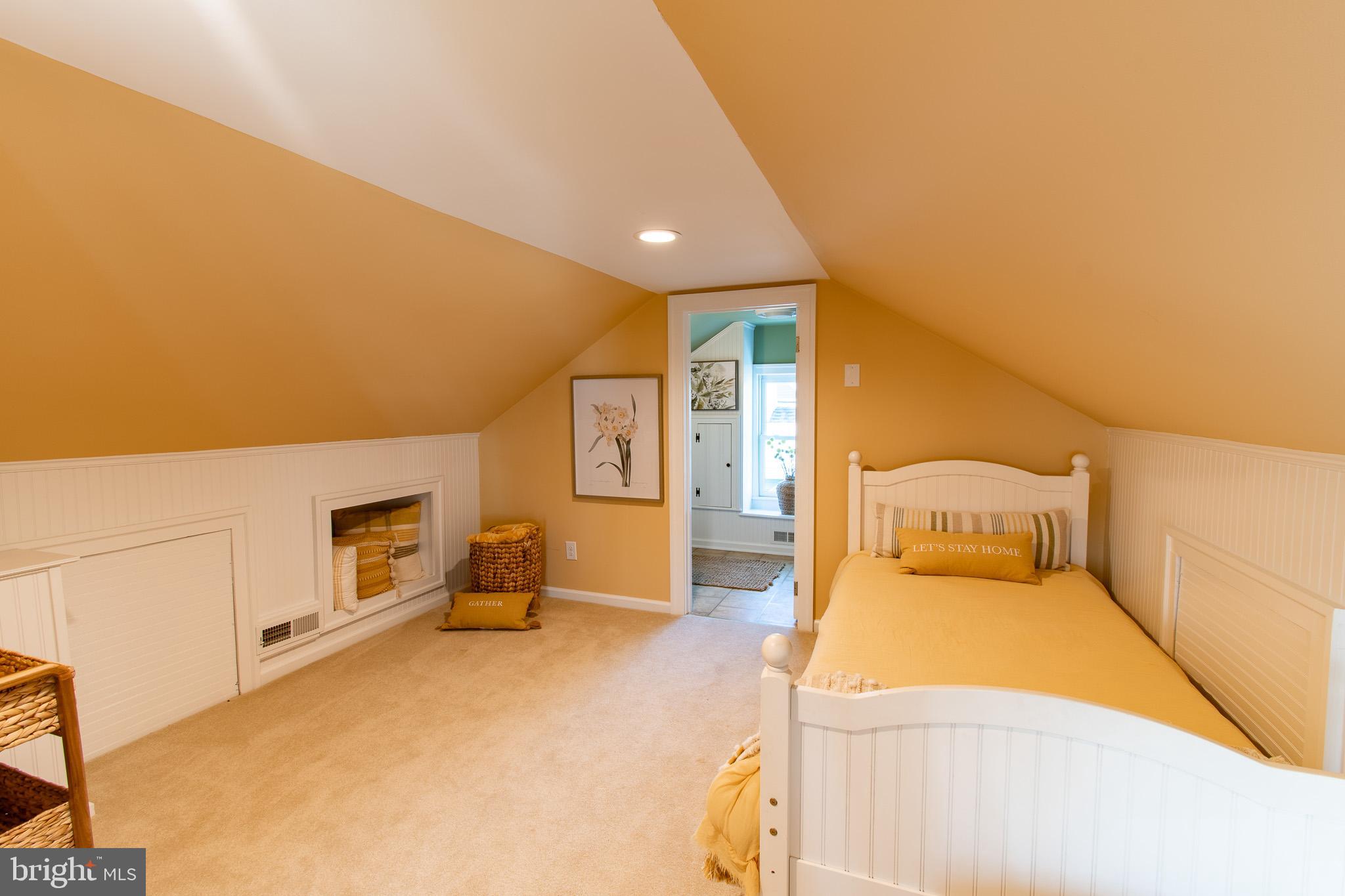 114 West Chestnut Street St. Michaels, MD 21663 - Photo 33 of 75 a spacious bedroom with a bed and dresser