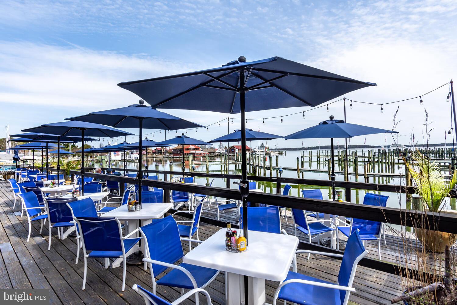 114 West Chestnut Street St. Michaels, MD 21663 - Photo 65 of 75 an outdoor space with furniture and umbrella