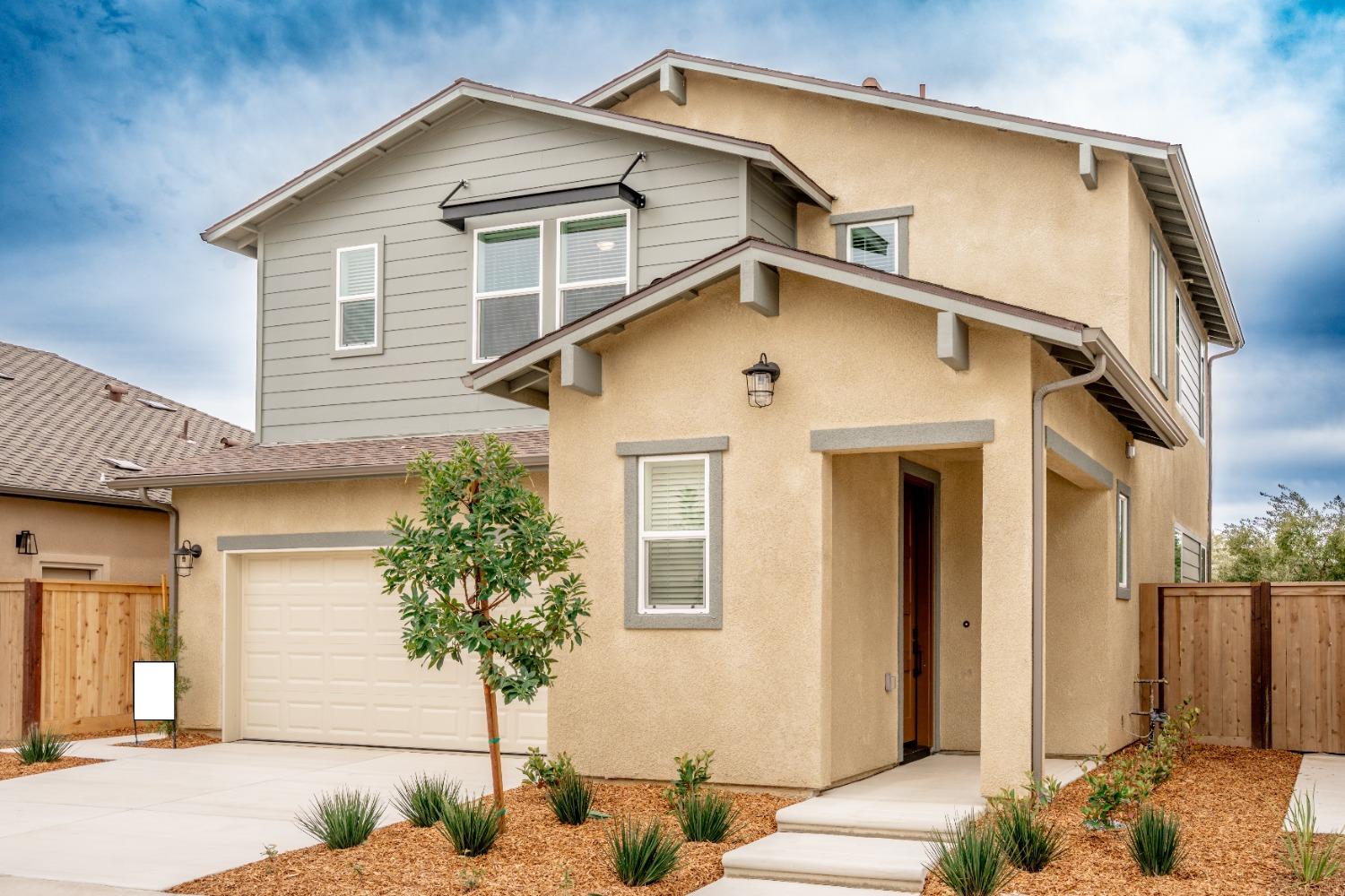 696 Philip Way Madera, CA 93636 - Photo 1 of 23 a front view of a house with street