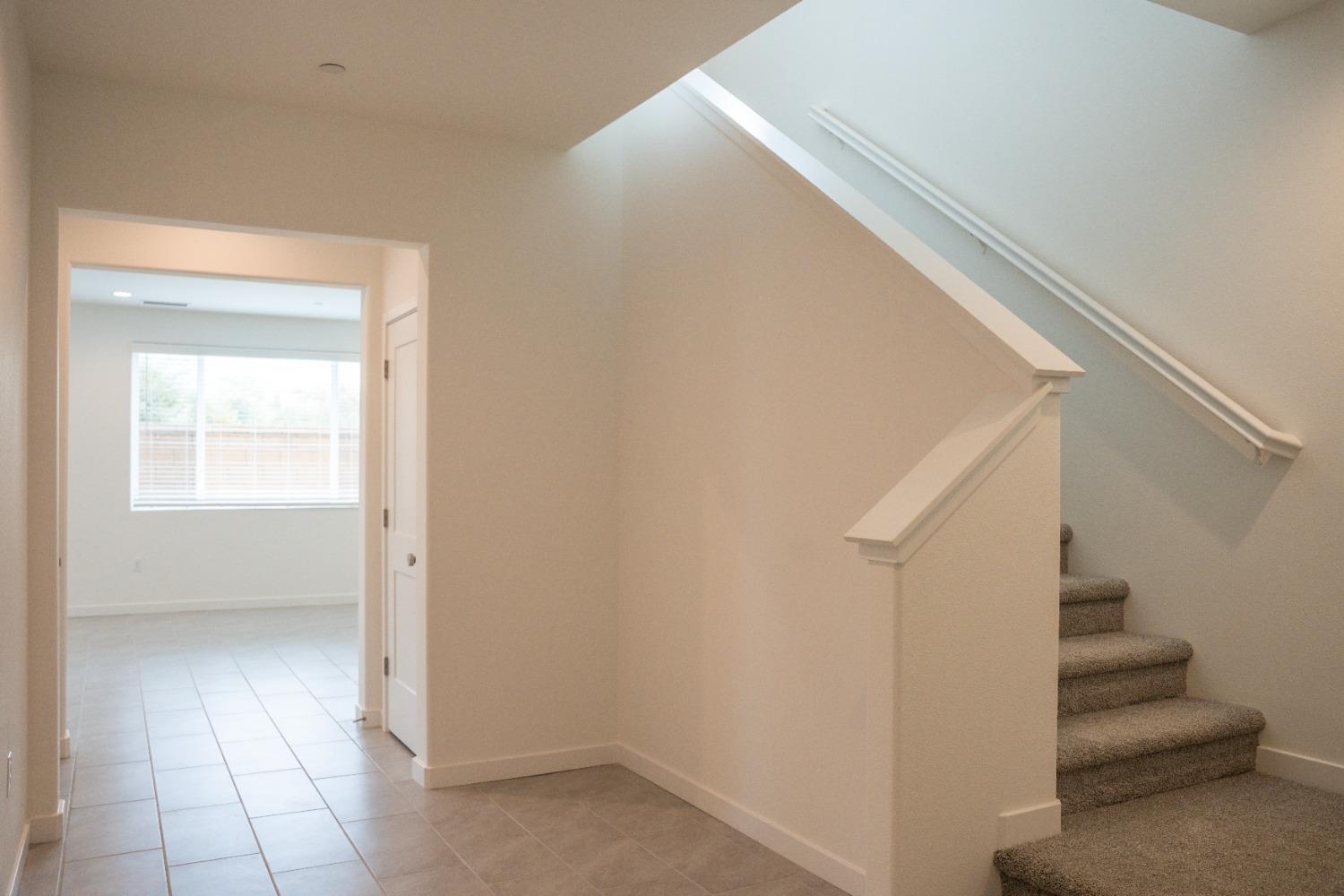 696 Philip Way Madera, CA 93636 - Photo 7 of 23 a view of entryway and hall with a window
