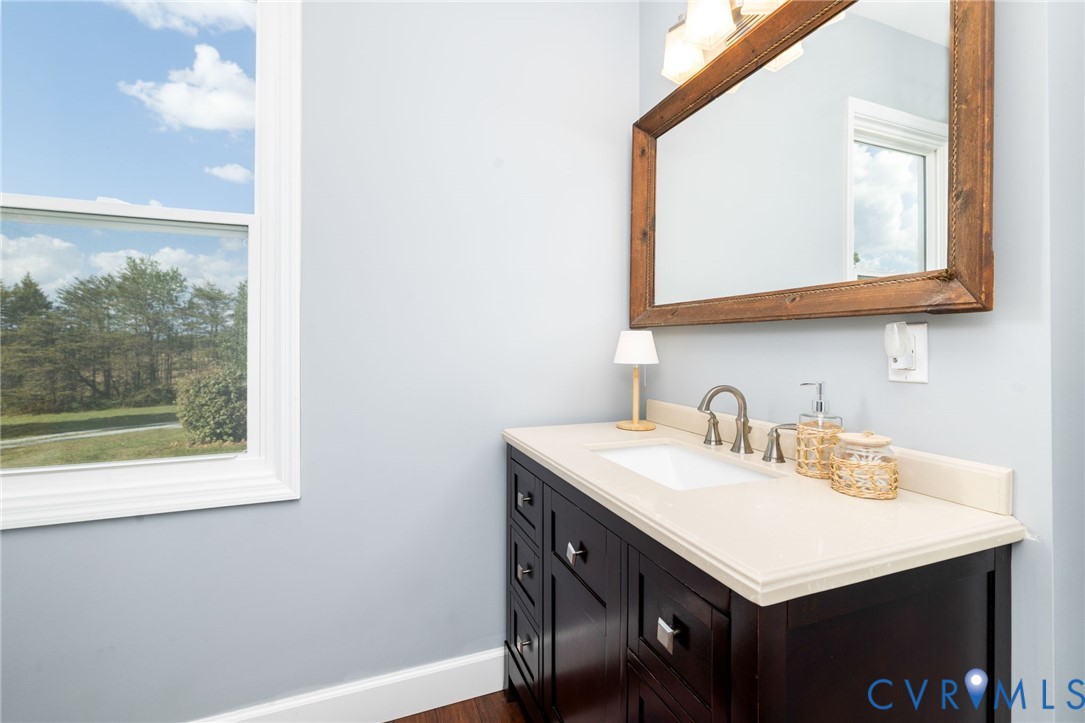 1895 Cemetery Road Chase City, VA 23924 - Photo 22 of 83 a bathroom with a sink vanity and a mirror