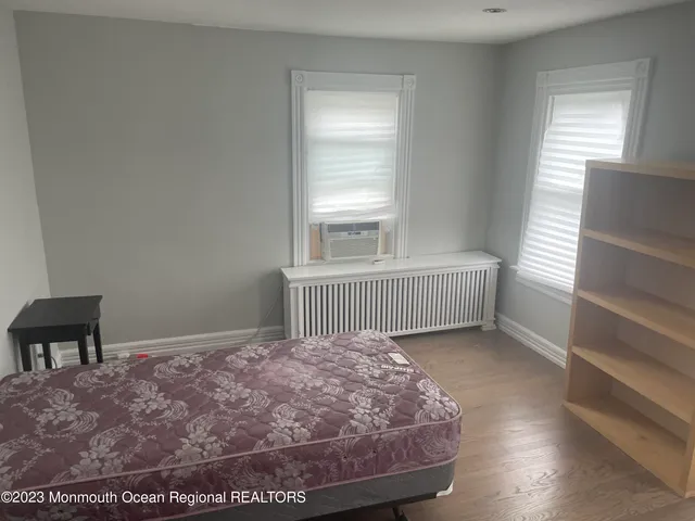 a room with a bed and a window