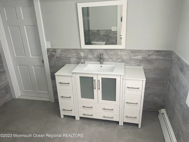 a bathroom with a sink and a mirror
