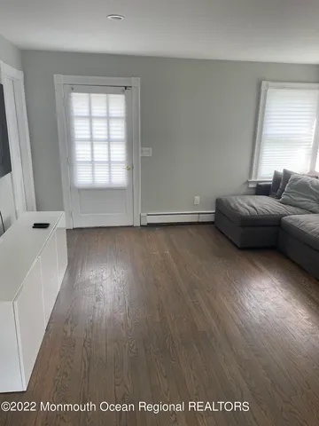 a view of livingroom with furniture and wooden floor