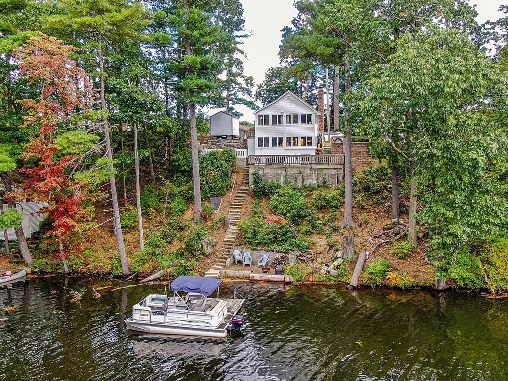 98 Boat House Road Groton, MA 01450 - Photo 1 of 39 a front view of a house with a yard