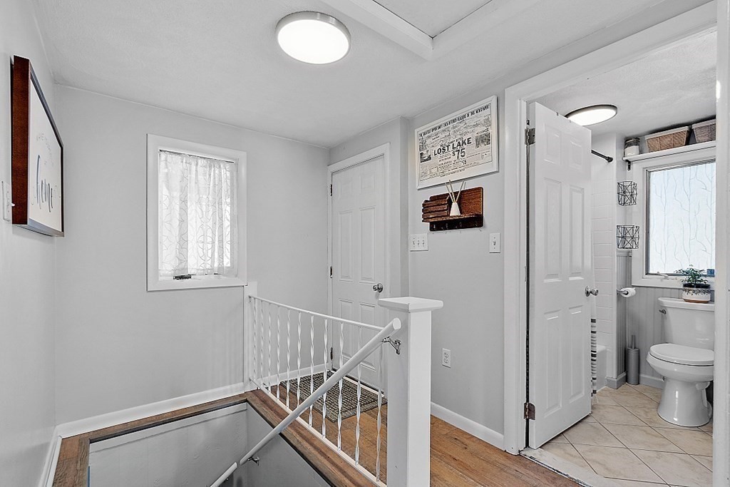 98 Boat House Road Groton, MA 01450 - Photo 17 of 39 a view of a hallway with workspace