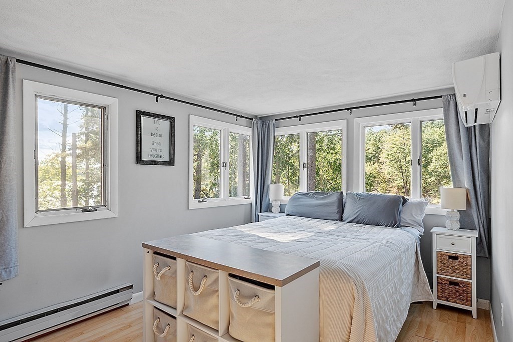 98 Boat House Road Groton, MA 01450 - Photo 18 of 39 a bedroom with a large bed and a window
