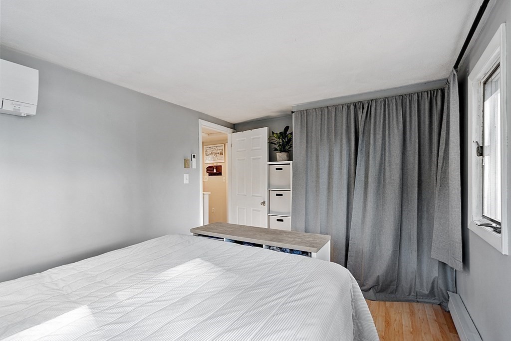 98 Boat House Road Groton, MA 01450 - Photo 20 of 39 a bedroom with a bed and a window
