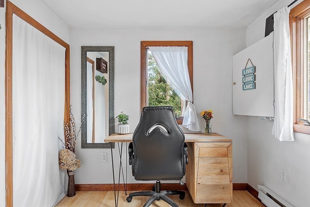 98 Boat House Road Groton, MA 01450 - Photo 22 of 39 a view of a workspace with furniture and a window