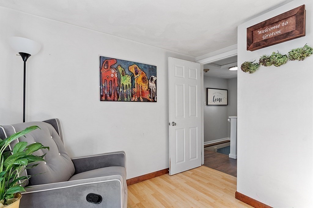 98 Boat House Road Groton, MA 01450 - Photo 23 of 39 a living room with furniture and a potted plant